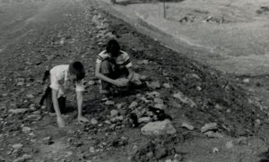 Terry and his friend working in the soil for glacier evidence.